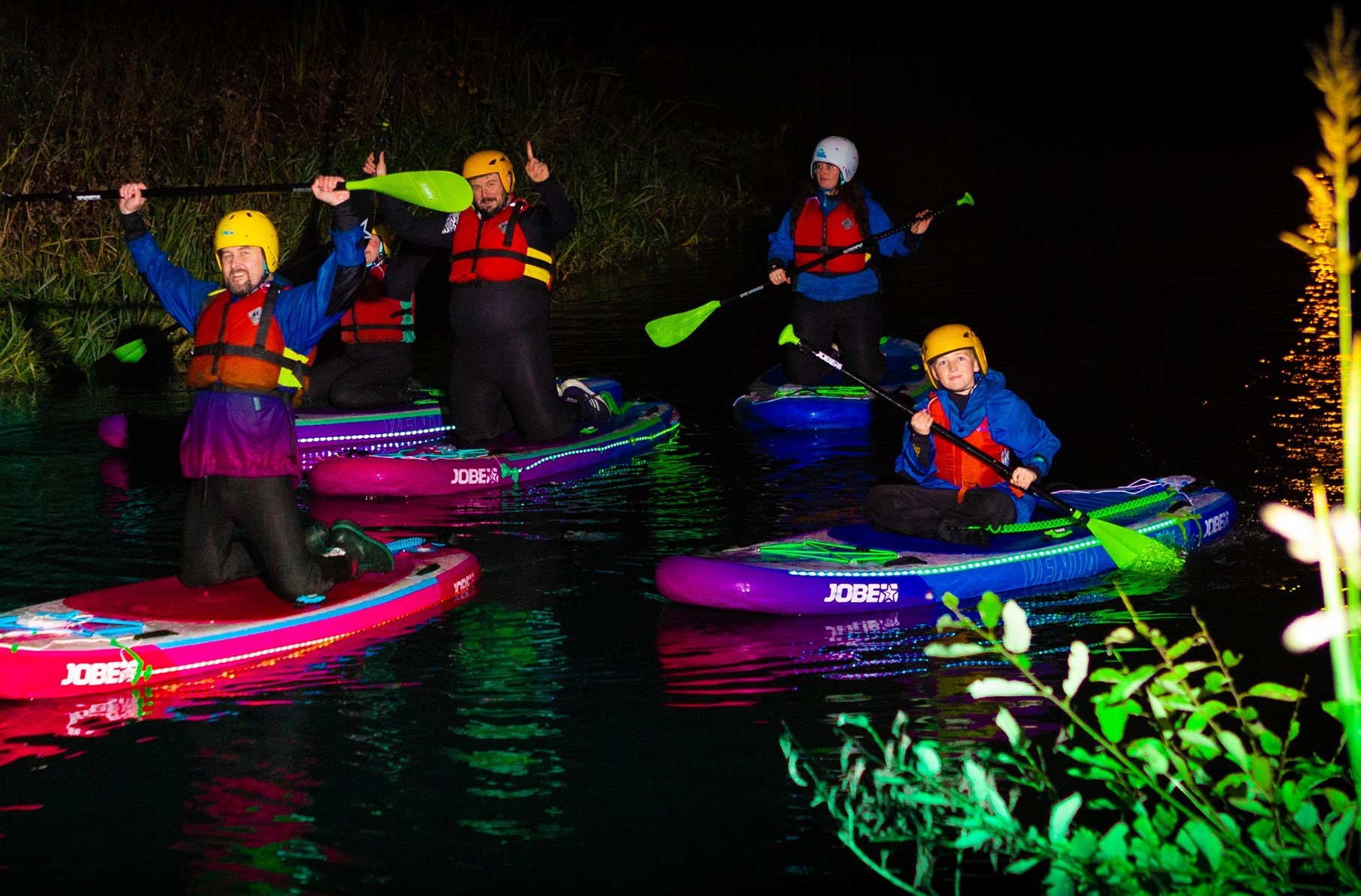 a group of people riding skis on a raft