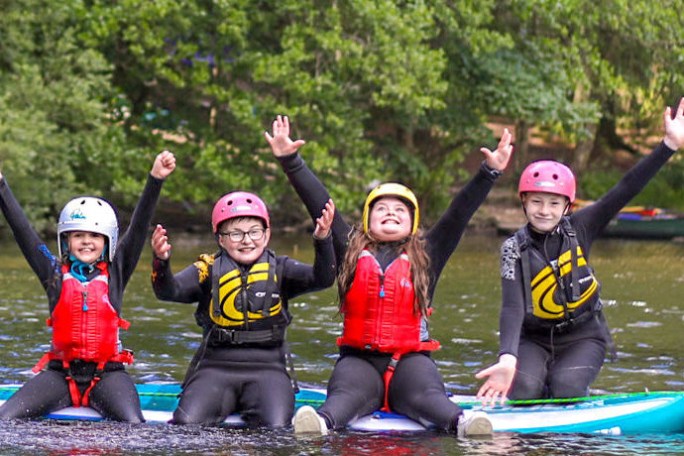 a group of people on a raft