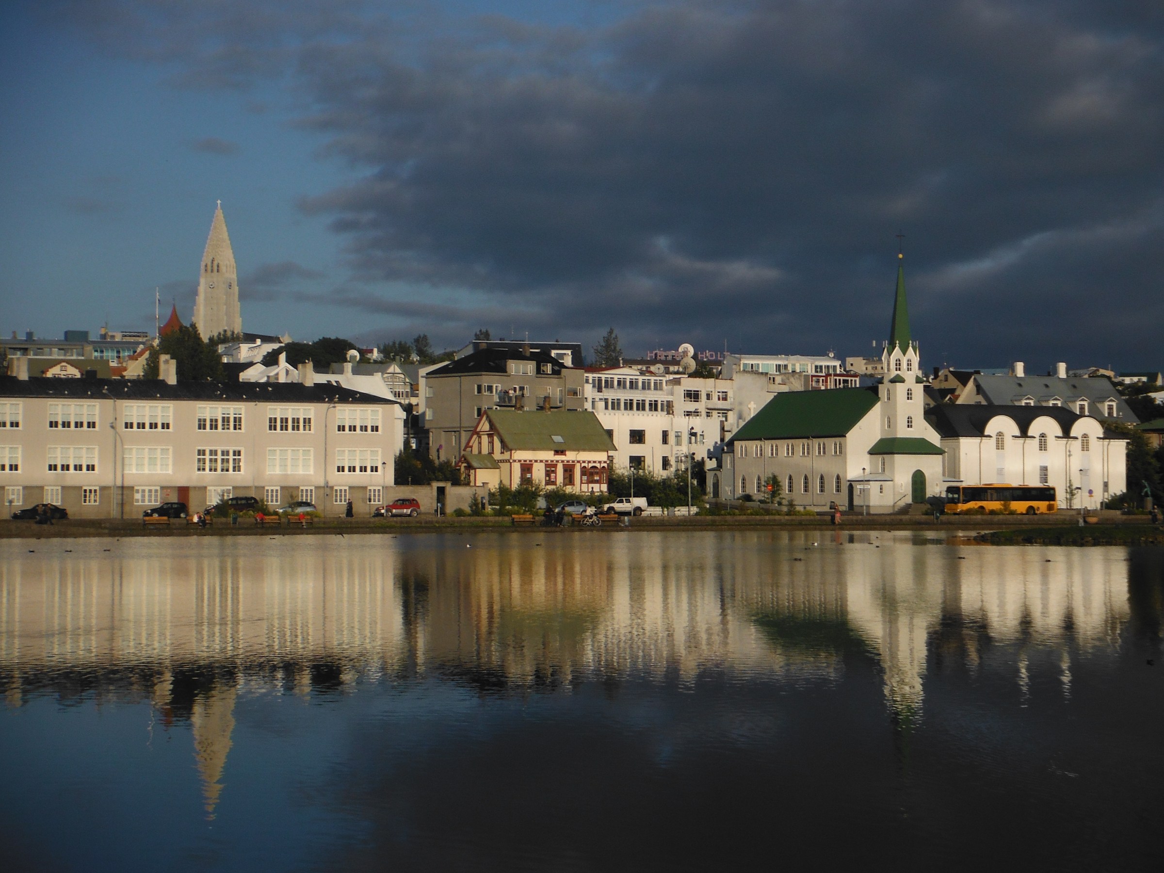 a castle with water in front of a body of water
