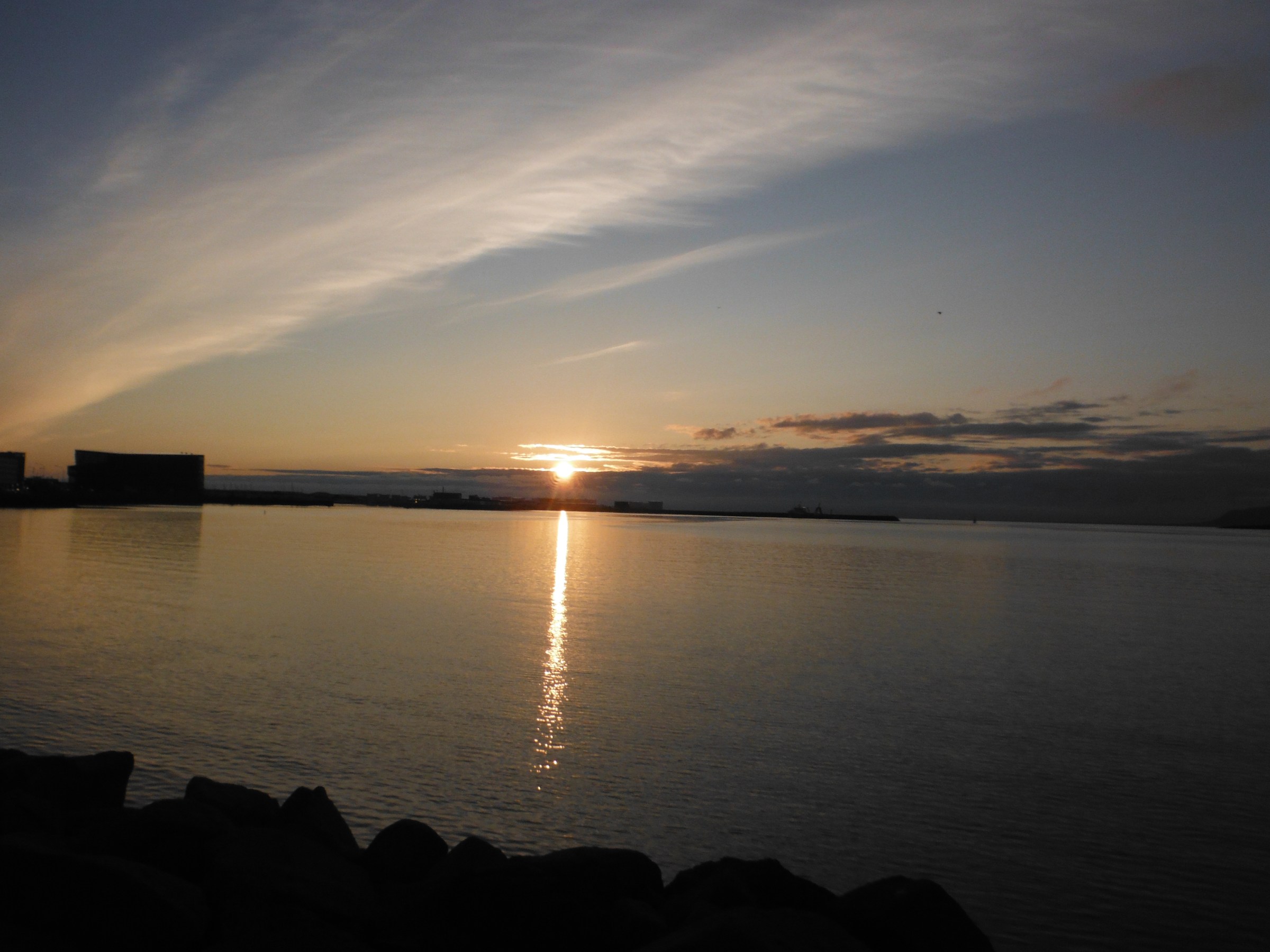 a sunset over a body of water